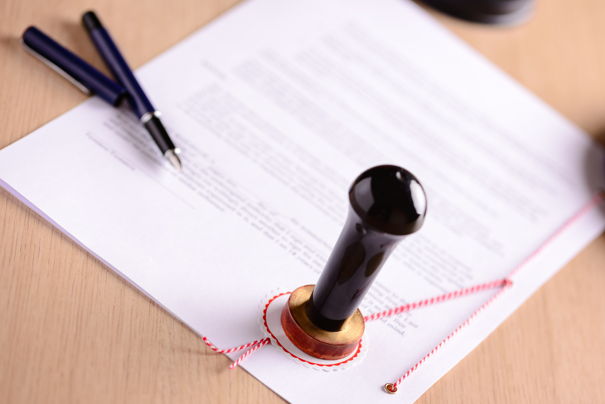 Notary's public pen and stamp on testament and last will. Notary public tools